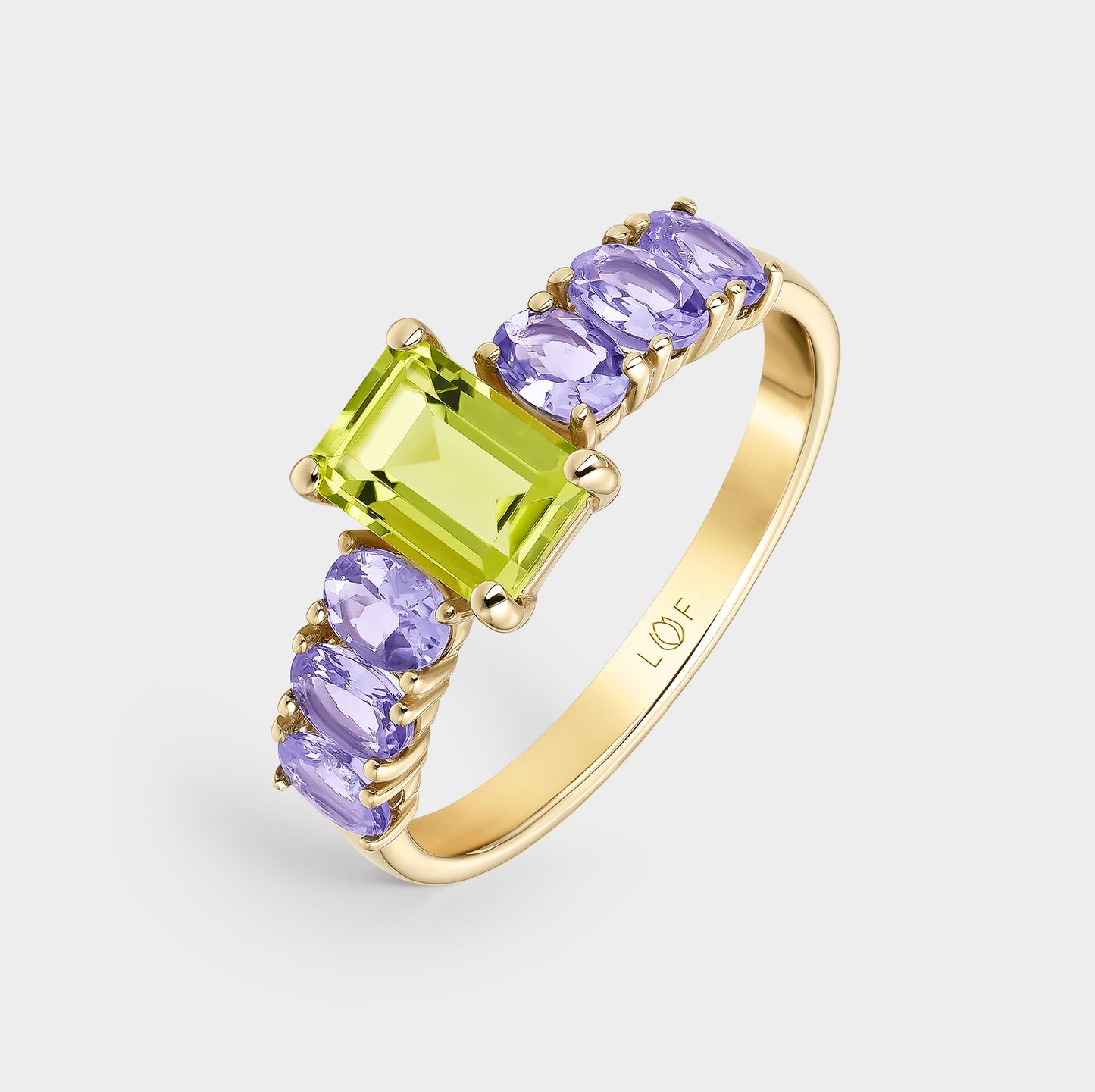 ANILLO ORO AMARILLO 18K PERIDOTO OCTOGONAL Y TANZANITAS OVALES