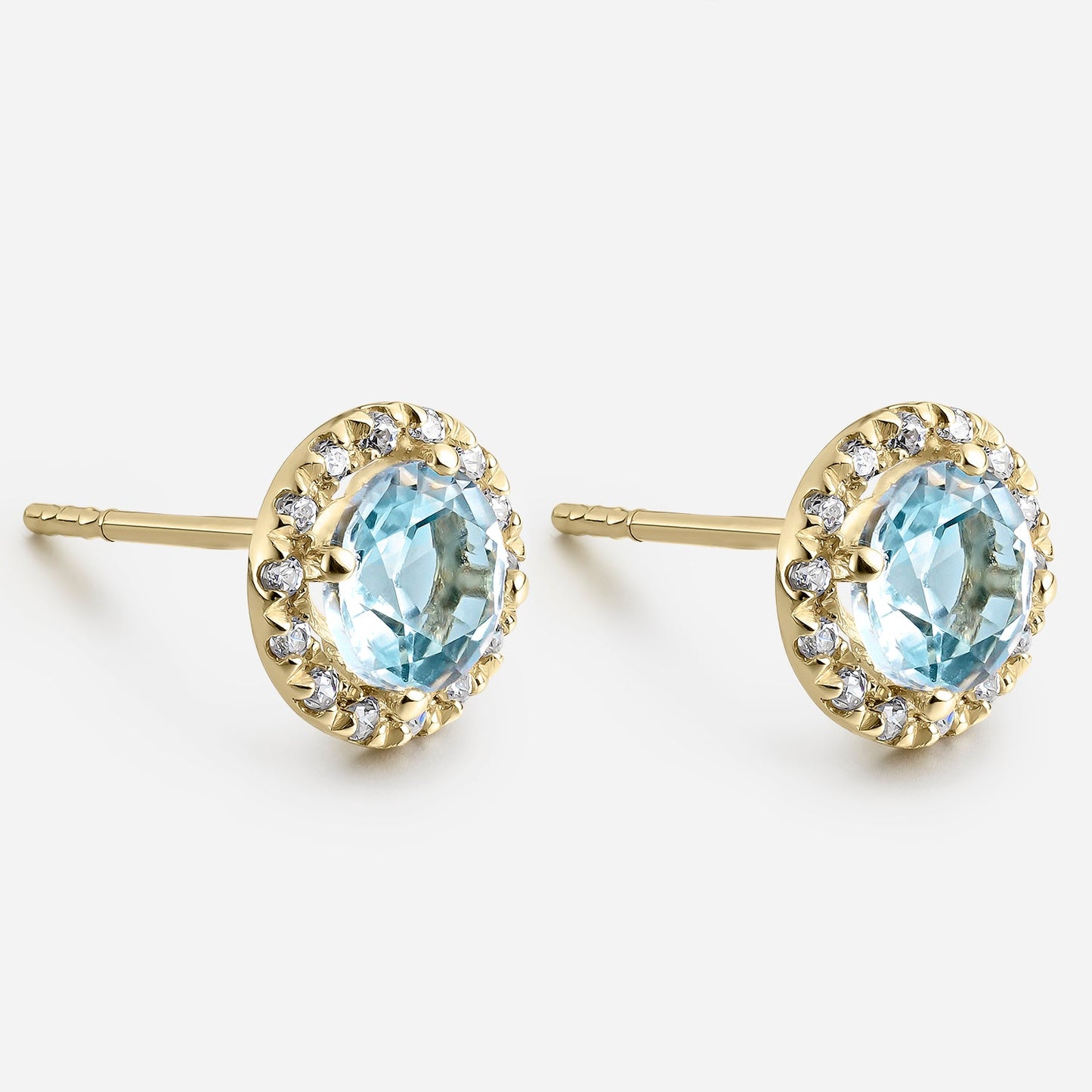 Pendientes topacio 5mm con circonitas
en oro de 18 quilates.