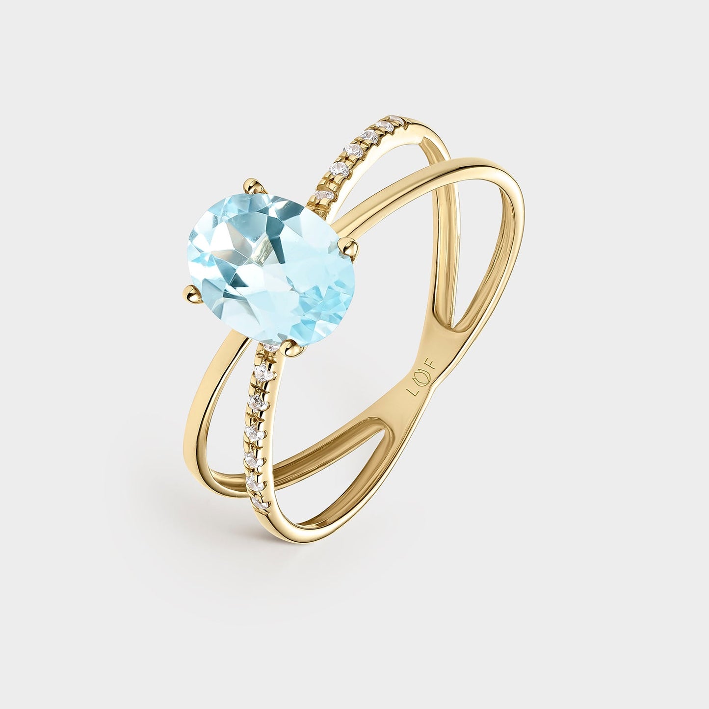 Sortija oro amarillo topacio azul fino y circonitas