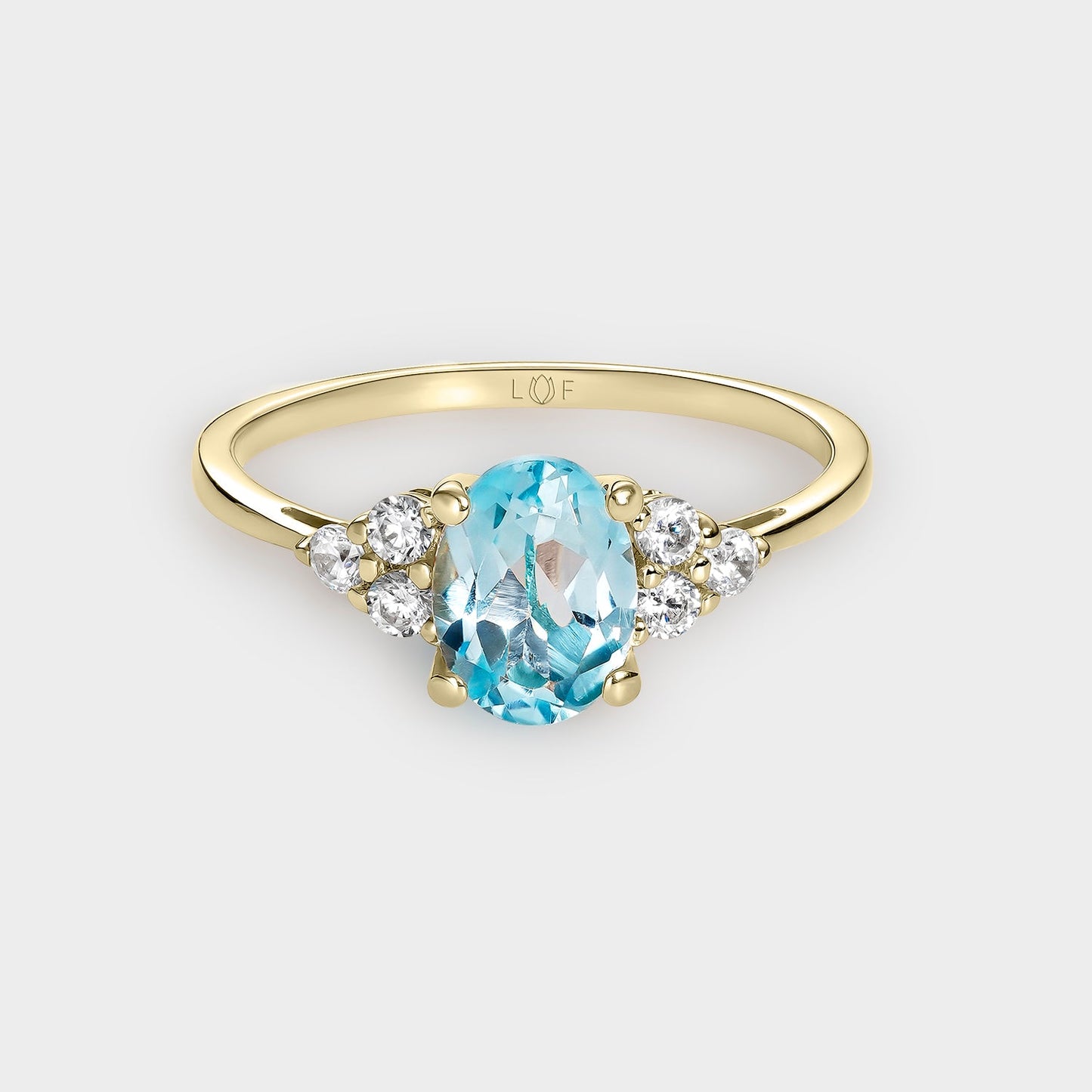 ANILLO TOPACIO 8*6 Y CIRCONITAS
EN ORO DE 18 QUILATES.