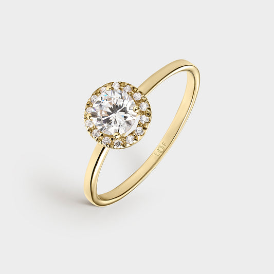 ANILLO ORO AMARILLO 18K CIRCONITAS Y TOPACIO BLANCO CENTRAL