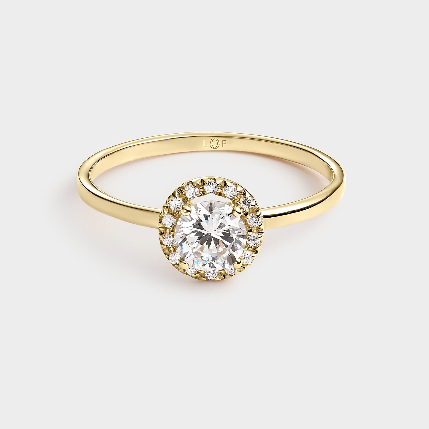 ANILLO ORO AMARILLO 18K CIRCONITAS Y TOPACIO BLANCO CENTRAL