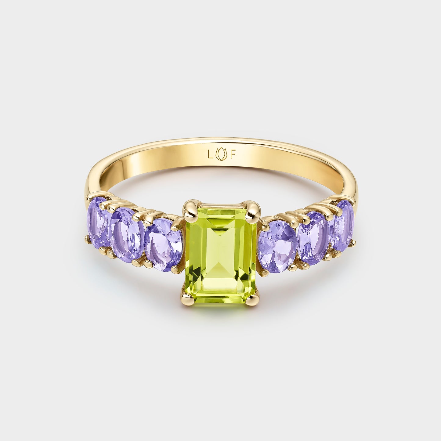 ANILLO ORO AMARILLO 18K PERIDOTO OCTOGONAL Y TANZANITAS OVALES