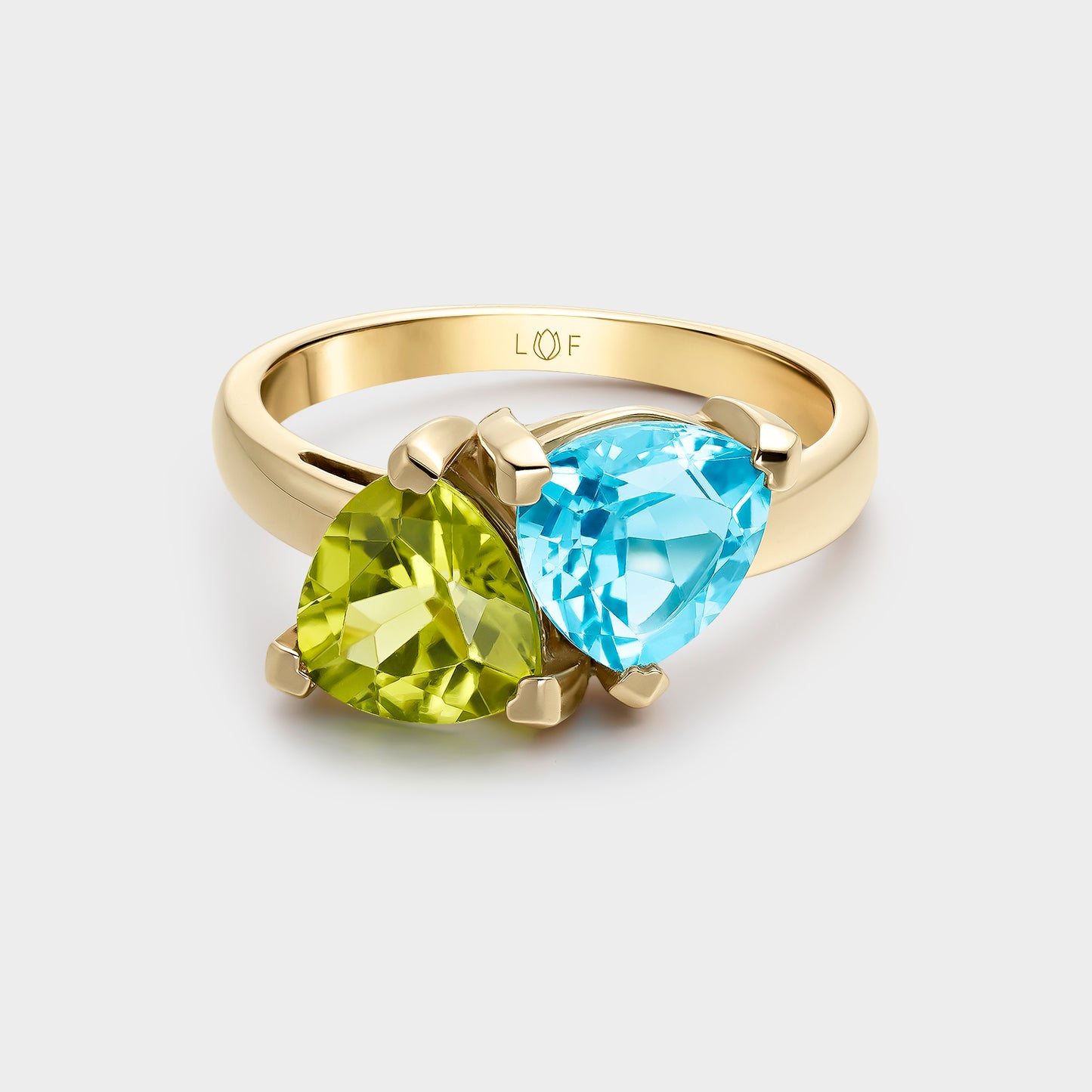 ANILLO ORO AMARILLO 18 KILATES TRILLON PERIDOTO Y TRILLON TOPACIO SWISS