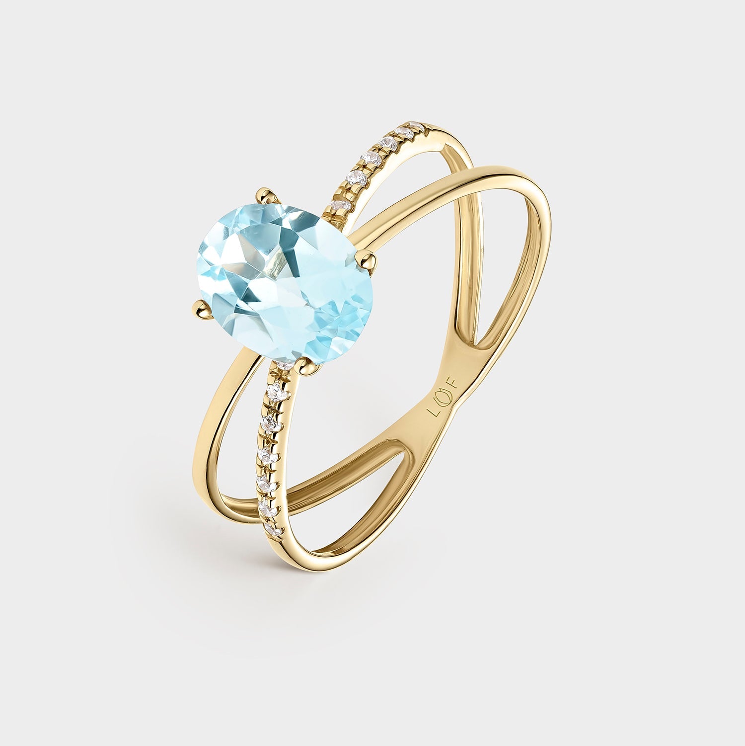 Sortija oro amarillo topacio azul fino y circonitas